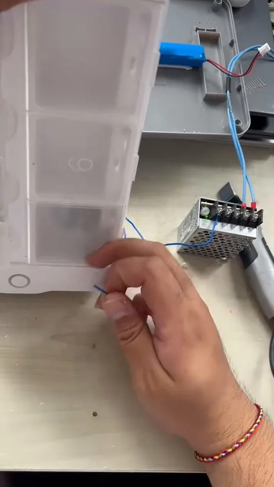 An off-the-shelf organiser box, wired for our opening mechanism